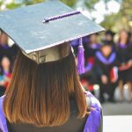 woman wearing academic cap and dress selective focus photography