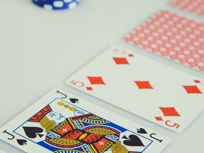 assorted playing cards on white surface